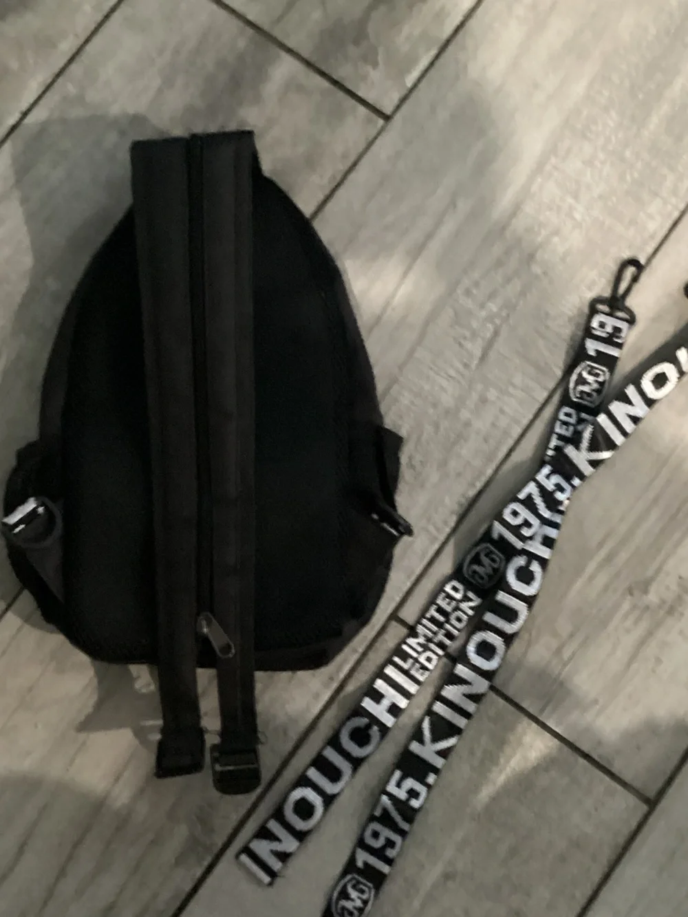 Black Sling Backpack with 'Don't Touch My Bag' Graphic